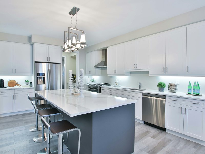 Glossy white cabinets in a bright kitchen