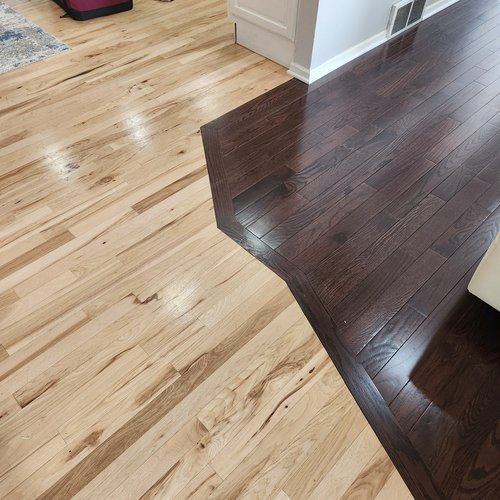 Light and dark hardwood floors side by side